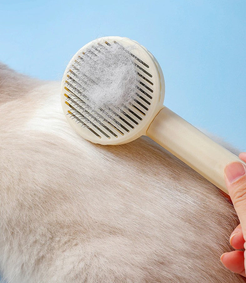 Cepillo masajeador y elimina pelo para mascotas